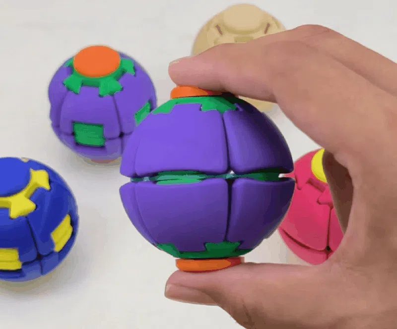 Press-to-spin balls in several colors